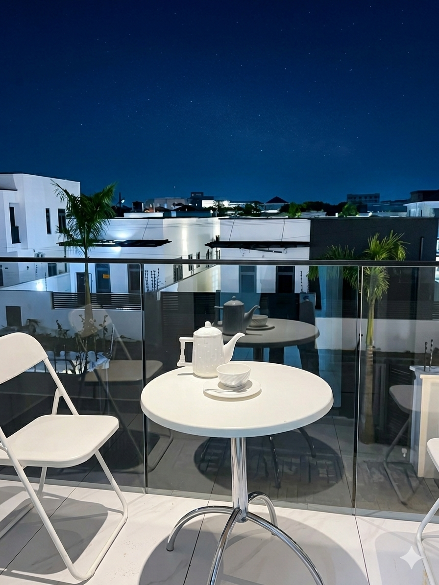 Private balcony at night with starry sky and glass balustrade